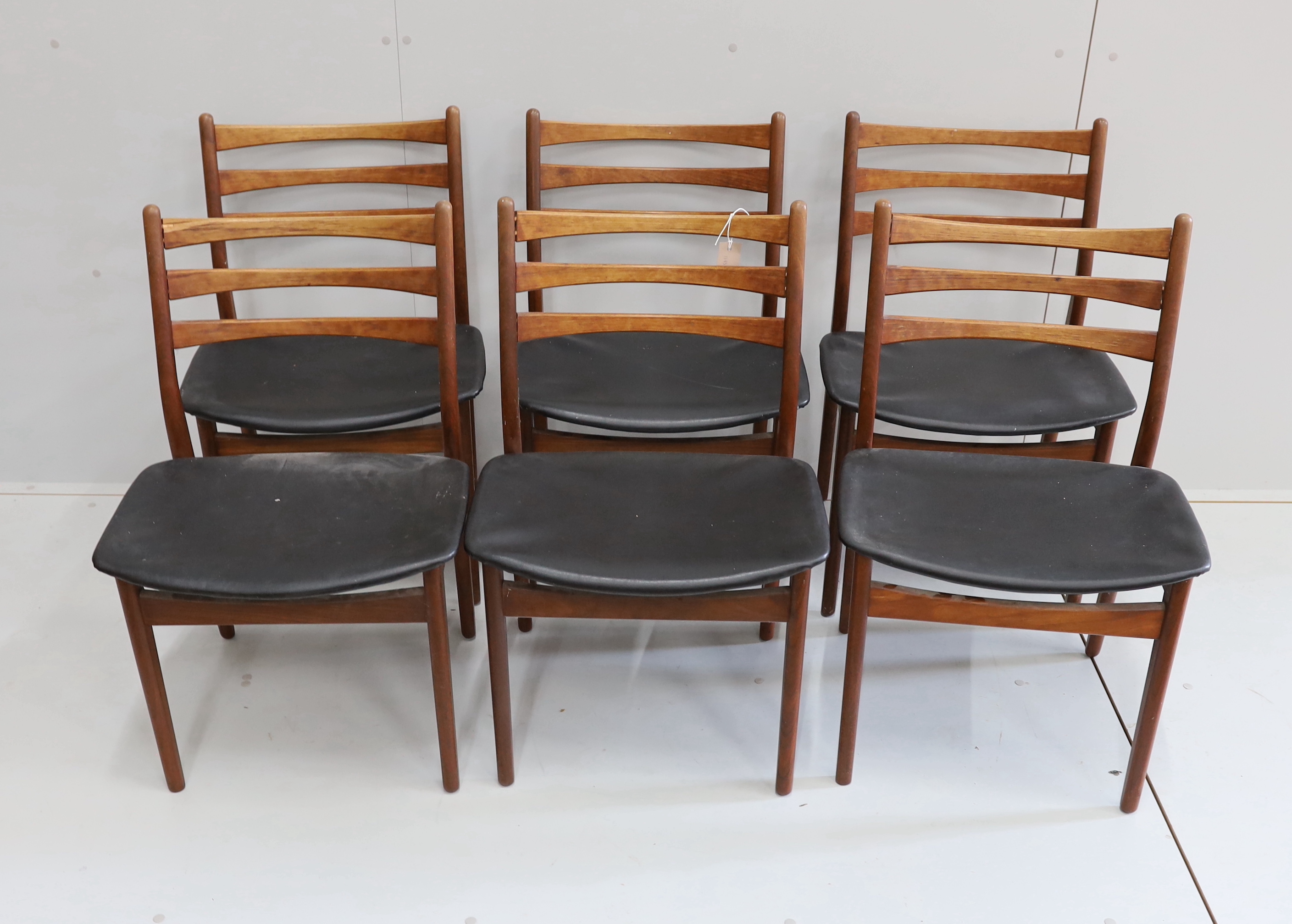 A set of six mid century, Danish design, teak and black leatherette dining chairs, width 50cm, depth 40cm, height 80cm